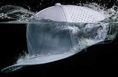 melin HYDRO hat splashing in the water