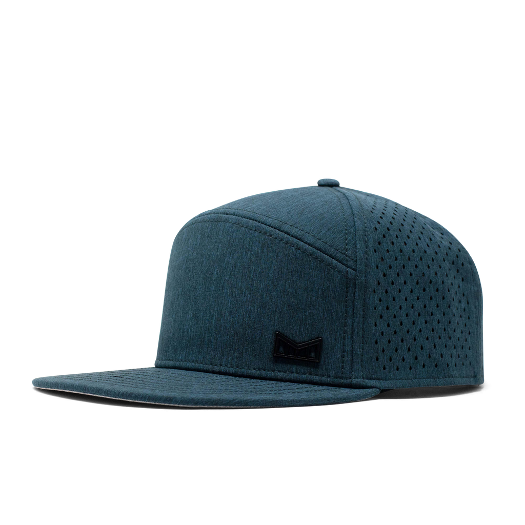 The angled view of the Melin Horizon Fit Treches Icon Hydro hat in dark blue Big Image - 1