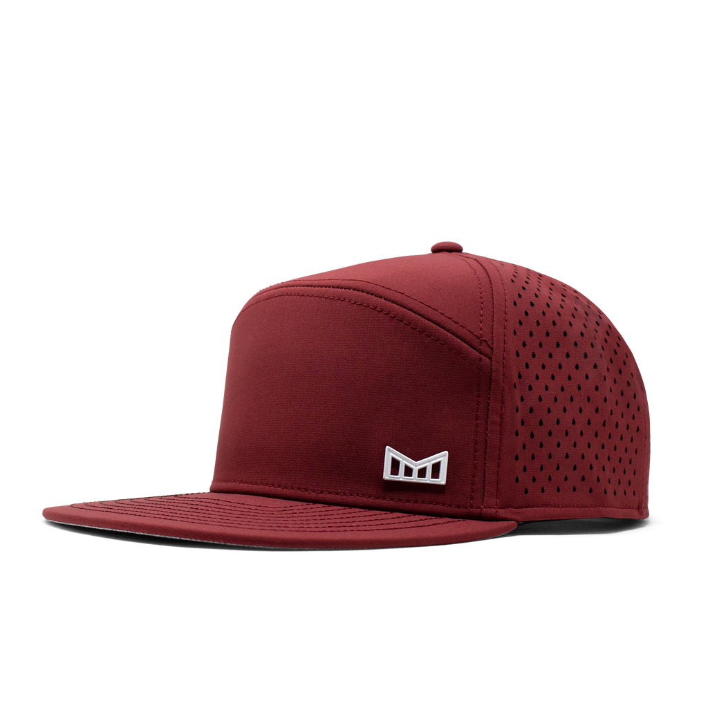 The angled view of the Melin Horizon Fit Trenches Icon Hydro hat in maroon Big Image - 1