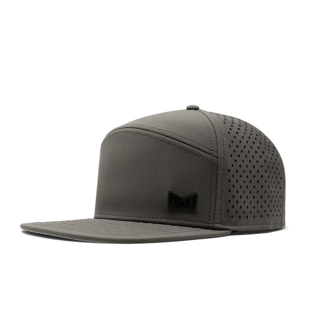 The angled view of the Melin Horizon Fit Trenches Icon Hydro hat in green Big Image - 1